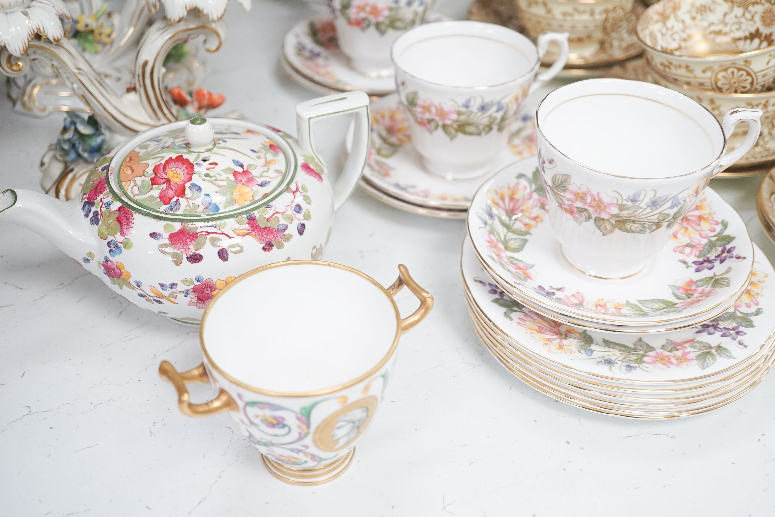 A Crown Staffordshire fifty nine piece part tea set and dessert service, central flowers and gilt borders, a Paragon part tea set and other ceramics